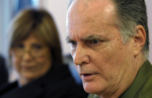 PRT President Sandra Torres, in the background, looks on as Associate Member Vicente Aguirre speaks during the hearing. (Credit: © Mauricio Pascual)